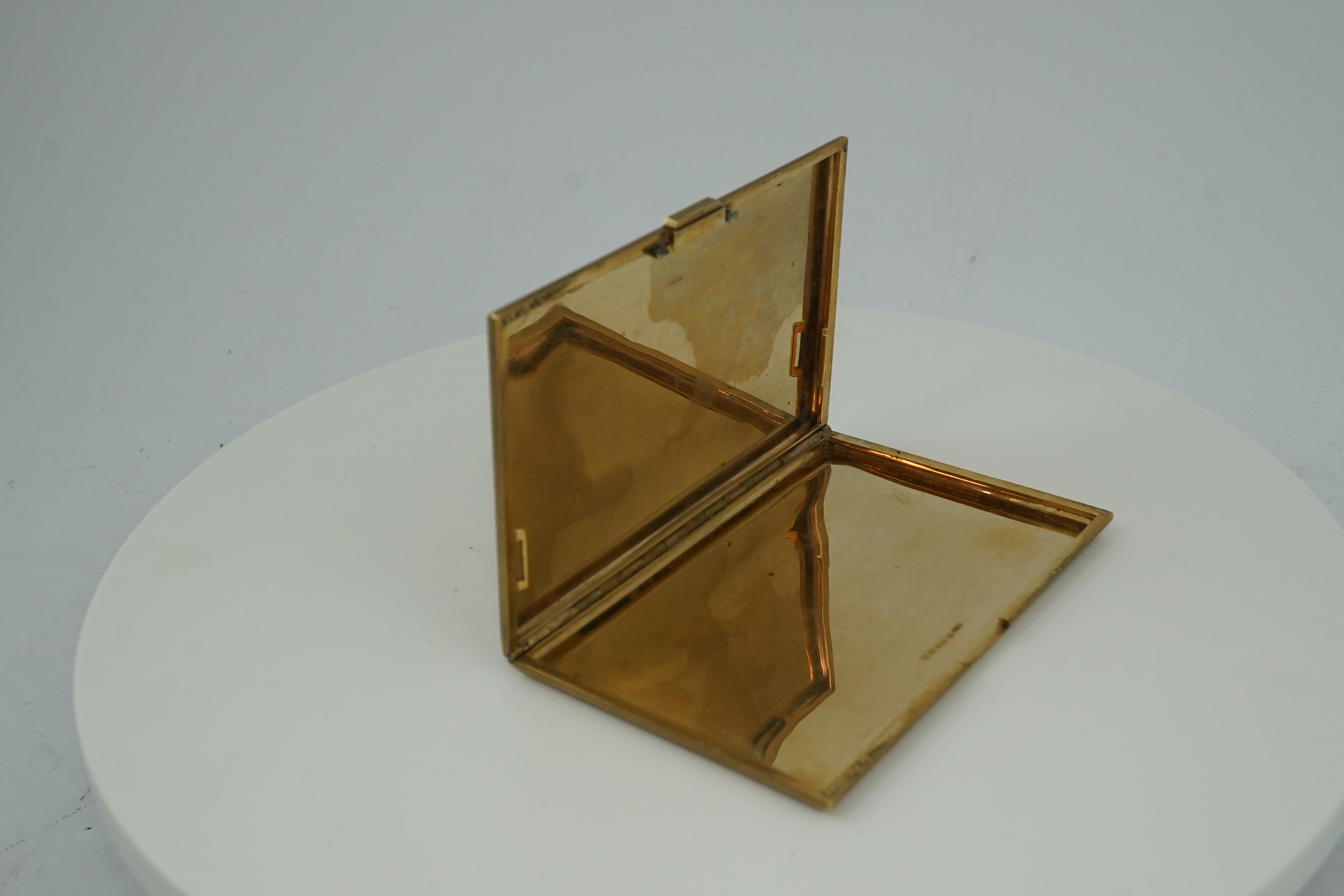 A 9ct gold rectangular cigarette case, circa 1947